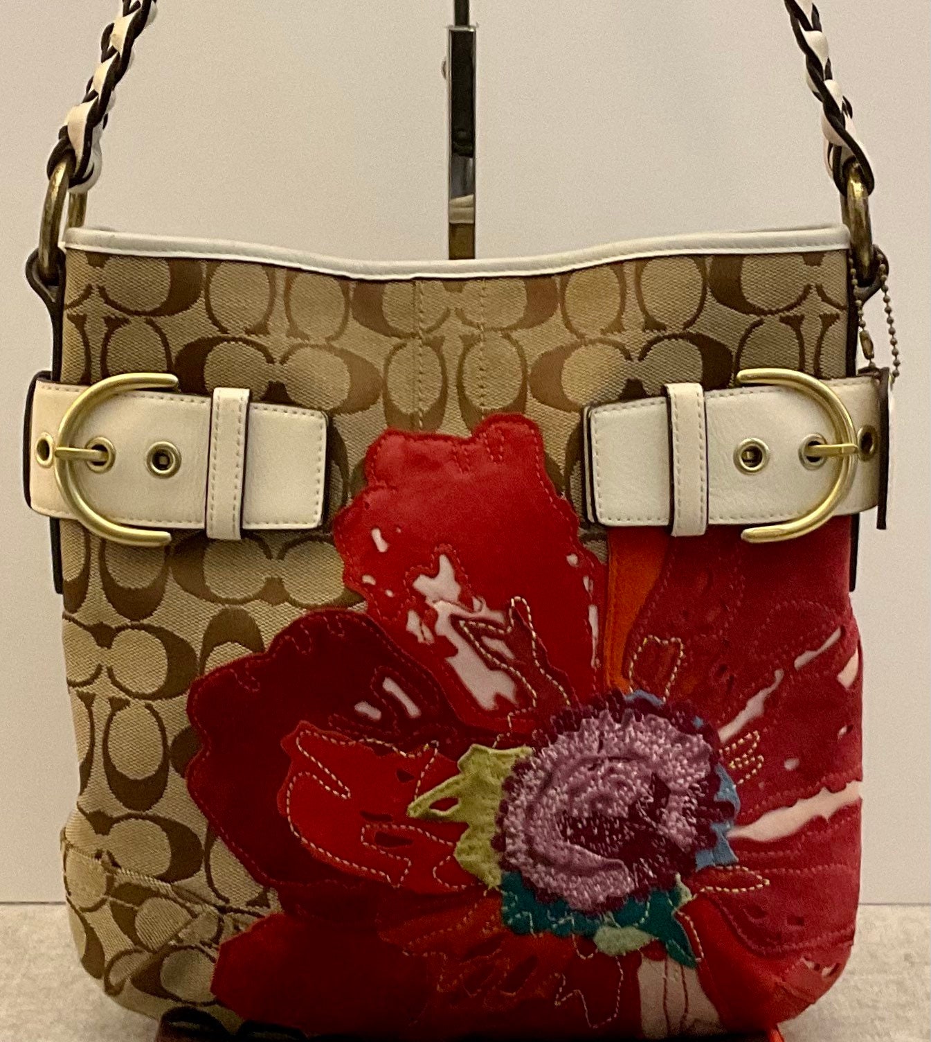 Coach bag with store flower applique