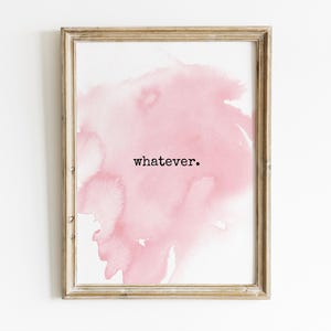 May include: Framed art print featuring a soft pink watercolor wash design. The artwork includes the word "whatever" in a black, minimalist font. The frame is a light, natural wood color, adding a touch of rustic charm to the piece.