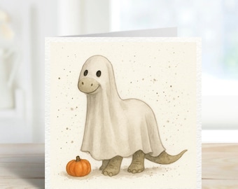 Cute Dinosaur Halloween Card – Ghost Costume Dino with Pumpkin – Funny Spooky Kids Greeting Card – Cute Halloween Dinosaur Card