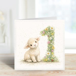 May include: A birthday card with a watercolour illustration of a lamb and a floral number one. The number is made of daisies, pink, yellow, and other flowers. The lamb sits on grass, looking at the viewer.