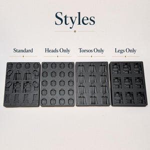 May include: Four black plastic molds for toy building blocks. The molds are labeled "Standard", "Heads Only", "Torsos Only", and "Legs Only". The word "Styles" is printed above the molds.