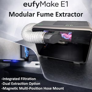 May include: A modular fume extractor, the eufyMake E1, is shown in a studio shot. The device is dark gray with a flexible hose attached. The text on the device reads "Integrated Filtration", "Dual Extraction Option", and "Magnetic Multi-Position Hose Mount".
