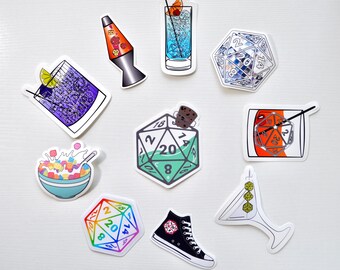 May include: A set of ten stickers featuring a variety of designs, including a lava lamp, a cocktail glass, a cereal bowl, a pair of sneakers, and a 20-sided die. The stickers are all white with black outlines and feature colorful details.