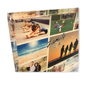 May include: A collage of family photos printed on a clear acrylic block. The photos show a family at the beach, playing soccer, and doing gymnastics. The text "Family" with a heart symbol is printed on the block.