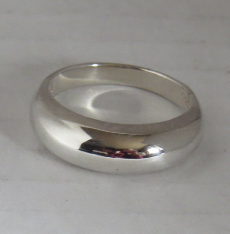 Exceptionally fine domed simplistic sterling silver band