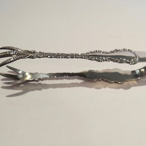 Elegant scarce find  sterling silver sugar tongs perfect for pickles or other culinary delights