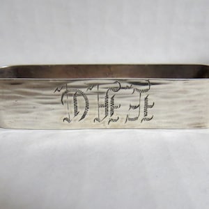 Sterling silver monogrammed vintage napkin ring with unusual shape