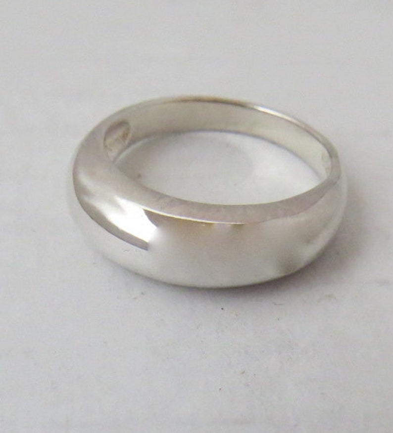 Exceptionally fine domed simplistic sterling silver band