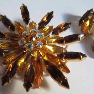 Outstanding brilliant amber rhinestone starburst brooch and earrings