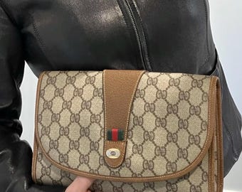 Vintage Authentic Gucci Clutch monogrammed , timeless and classic this clutch/pouch