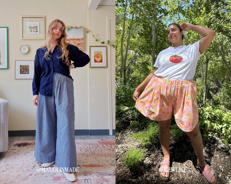 May include: Two women wearing different outfits. The woman on the left is wearing a navy blue long-sleeved shirt and wide-legged striped pants. The woman on the right is wearing a white t-shirt with a red tomato graphic and pink floral print shorts. Both women are standing in front of a background.