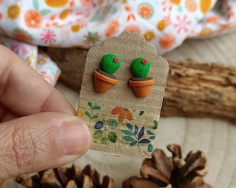 Cactus lobe earrings in polymer clay. Red flower