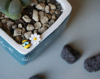 Bee and white flower stud earrings in polymer clay