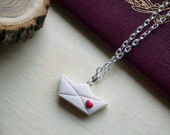 Origami Travel paper boat necklace in polymer clay. Handmade