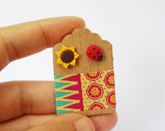 Sunflower and Ladybug stud earrings in polymer clay