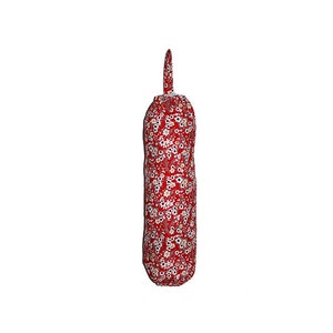 May include: Red fabric bag dispenser with a white floral pattern. The dispenser has a loop at the top for hanging.