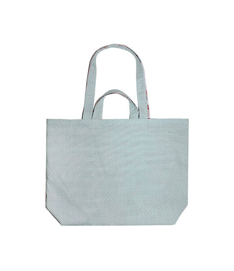 May include: A light blue tote bag with a white polka dot pattern and red and white patterned handles.