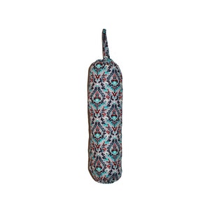 May include: A gray fabric bag with a blue, red, and green floral pattern. The bag has a drawstring closure and a loop handle.