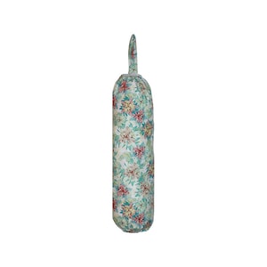 May include: A white fabric bag dispenser with a floral pattern in shades of green, pink, and yellow. The dispenser has a drawstring closure and a fabric handle.