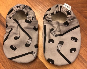 Hockey booties, hockey Moccs, grey and black Booties, puck moccs, hockey baby, hockey pucks, hockey stick slippers