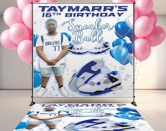 May include: A banner and floor mat set for a 16th birthday party, featuring a young person in a Dallas jersey, sneakers, and the words "Sneaker Ball." Pink and blue balloons decorate the scene.