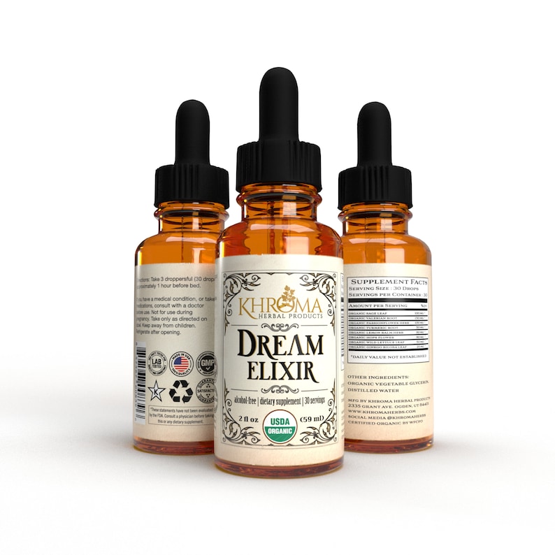 May include: Three amber glass bottles with droppers, each filled with a liquid. The bottles have labels that read "KHROMA HERBAL PRODUCTS" and "DREAM ELIXIR". The label also states "alcohol-free | dietary supplement | 30 servings" and "2 fl oz (59 ml)". The bottles are set against a white background.