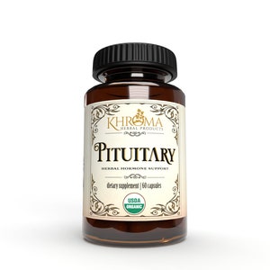 May include: A brown glass bottle with a black lid and a label that says "KHROMA HERBAL PRODUCTS PITUITARY HERBAL HORMONE SUPPORT dietary supplement | 60 capsules USDA ORGANIC".