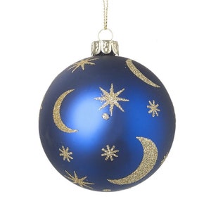 May include: A blue Christmas bauble with gold glitter stars and crescent moons.