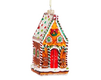 May include: A gingerbread house Christmas ornament with a red door, white frosting, and two gingerbread people. The ornament is decorated with candy canes, green leaves, and red and white sprinkles.