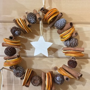 Cones, Orange Slices, Cinnamon Sticks Dried Fruit White Wooden Star Festive Wreath with Scented Christmas Fragrance