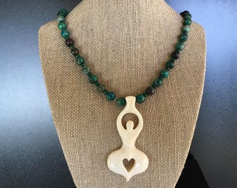 Natural green necklace with Chrysocolla, Emeralds and Pyrite beads.Bali’s handcrafted Goddess bone pendant. Healing Energy Jewelry.