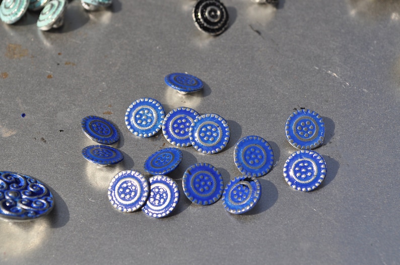 Unique blue painted blouse buttons hand made of Pewter and finished in the USA