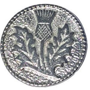 May include: A silver-toned metal button with a raised design of a thistle flower. The thistle is a traditional symbol of Scotland.