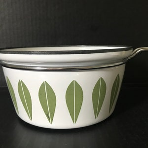 May include: White enamel saucepan with a green leaf pattern and a silver handle.
