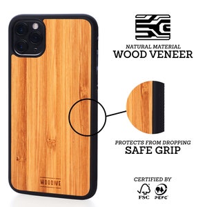 May include: A brown wood phone case with a black border and a black rubberized edge for a secure grip. The case is made from natural wood veneer and is certified by FSC and PEFC. The case is designed to protect your phone from drops.