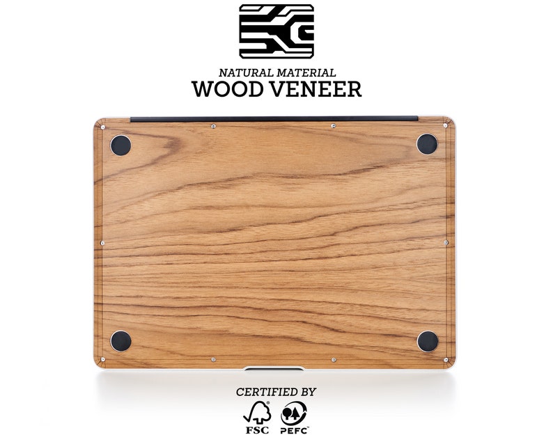 May include: A laptop with a wood veneer finish. The laptop is made from natural materials and is certified by the FSC and PEFC. The laptop has a wood grain pattern and is a light brown color.