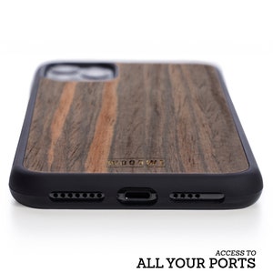 May include: A black and brown wood phone case with a black rubber bumper. The case has a gold logo that says "WOODWE".