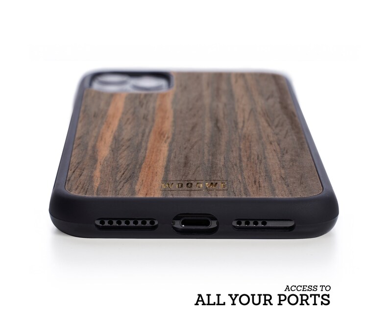 May include: A black and brown wood phone case with a black rubber bumper. The case has a gold logo that says "WOODWE".