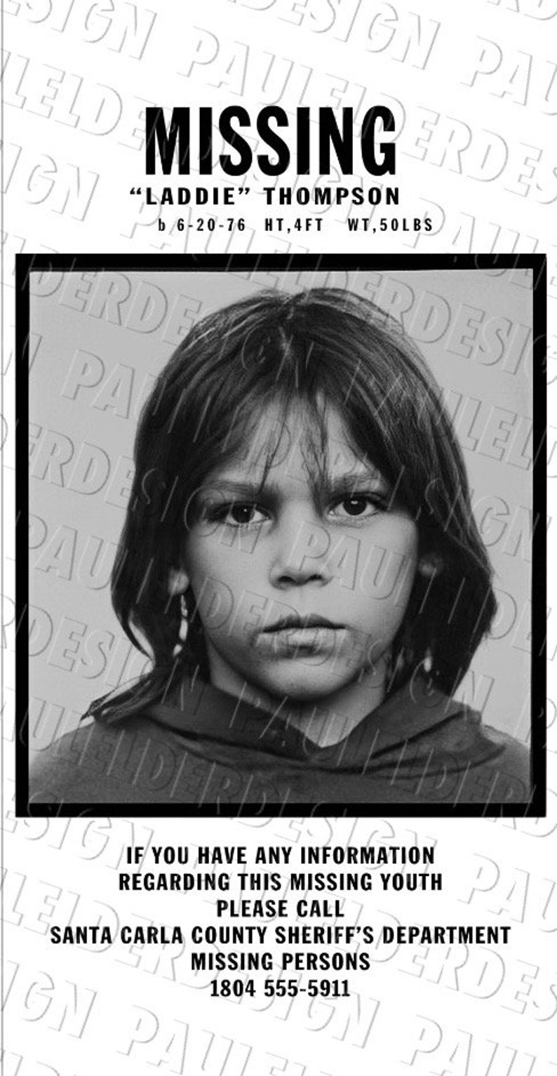 May include: Black and white missing person poster with a photo of a young person with long hair. The poster says "MISSING" in bold black letters and "Laddie" Thompson, b 6-20-76, HT, 4FT WT, 50LBS. The poster also includes contact information for the Santa Carla County Sheriff's Department Missing Persons, 1804 555-5911.