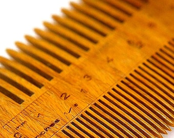 Green Sandalwood wooden comb with our unique addition, a RULER along the spine to measure your growth. No static or knots as well.