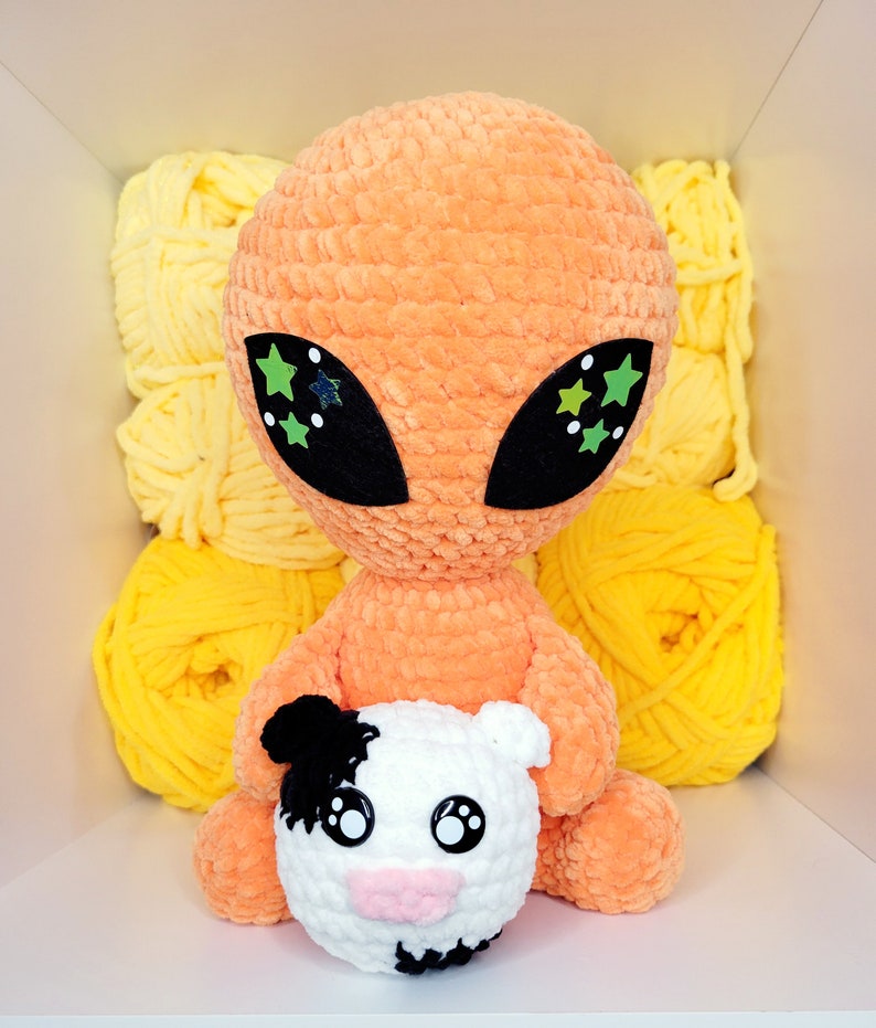 Out-of-this-world Cosmo the Alien crochet pattern with thorough guidance and vivid illustrations, perfect for handcrafting a lovable extraterrestrial pal, unforgettable gift, or quirky room decor!