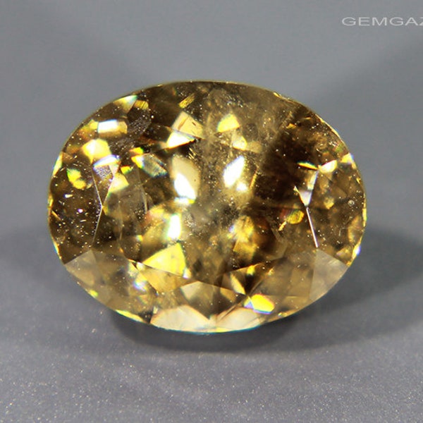 Cassiterite, yellow-brown faceted, Bolivia. 3.39 carats. (Video)