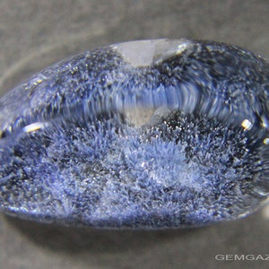 Quartz cabochon with blue Dumortierite crystal inclusions, Brazil.  16.74 carats.