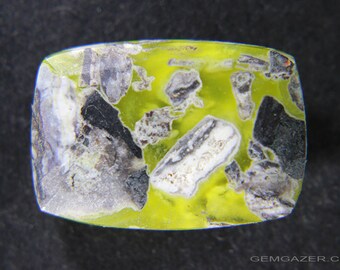 Ettringite in matrix, faceted, New Jersey USA.  9.05 carats.