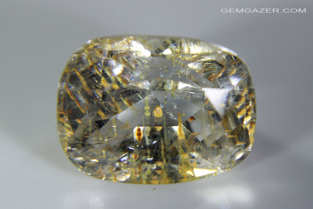 Topaz Inclusions Colourless Topaz With Golden Yellow Limonite Inclusions, Faceted ...