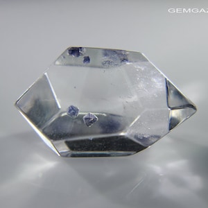 Polished Quartz with blue Fluorite crystal inclusions, Madagascar. 12.44 carats.