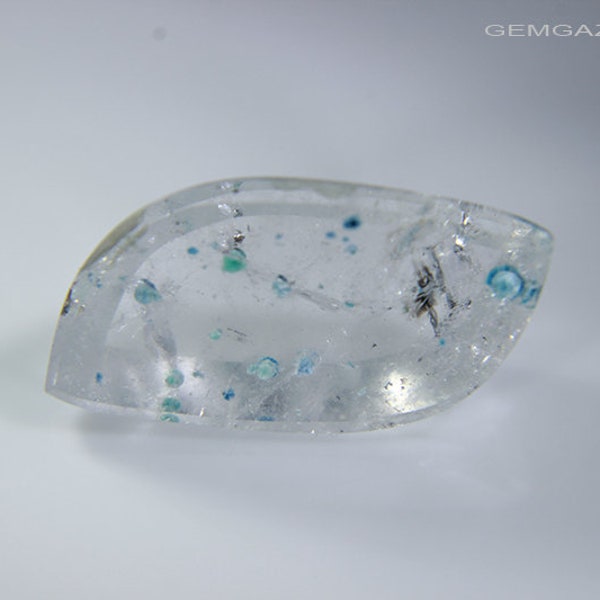 Quartz cabochon with green & blue Gilalite inclusions, Brazil. 6.32 carats.