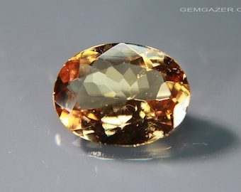Colour-change Garnet gemstone, amber to red, Tanzania. 1.26 carats.