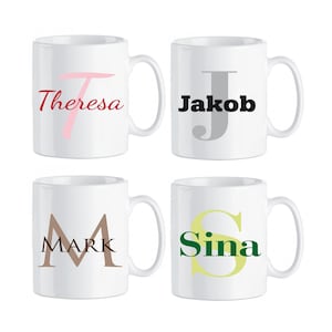May include: Four white ceramic mugs with personalized names and initial letters. The mugs are arranged in two rows of two. The names are Theresa, Jakob, Mark, and Sina. The initial letters are T, J, M, and S. The letters are in different colors and styles.