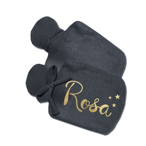 May include: A dark gray fleece hot water bottle with a gold inscription that reads "Rosa" and three gold stars.